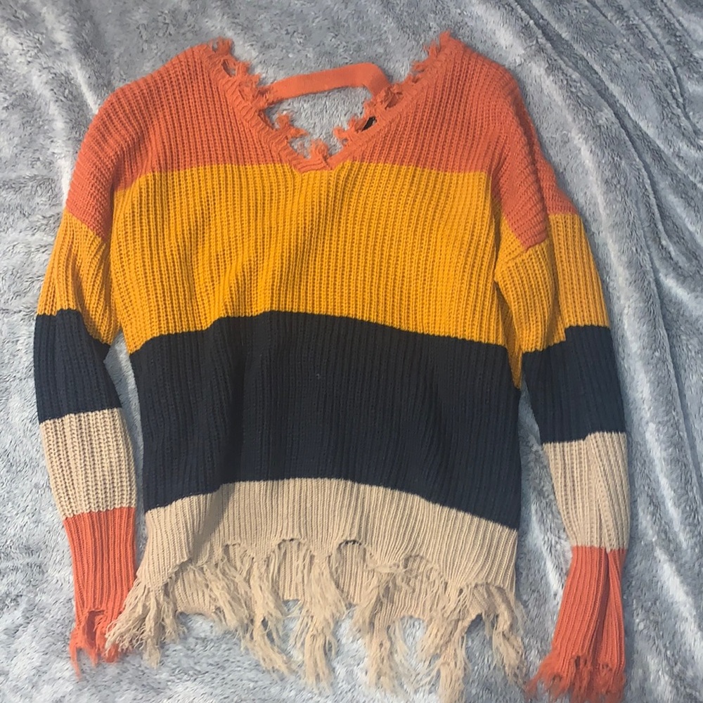 Orange, yellow, navy blue, and creme flared sweater